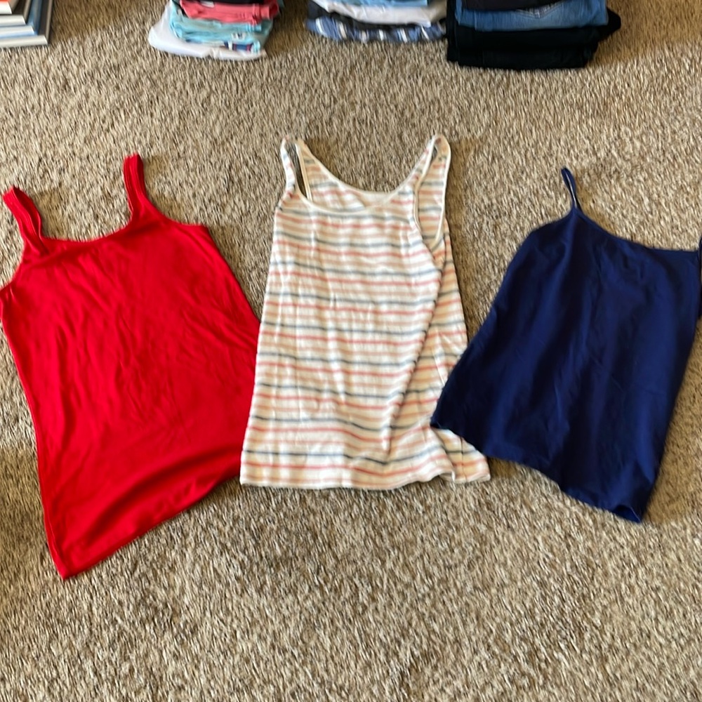 three price ate of red, blue, and stripped tanks